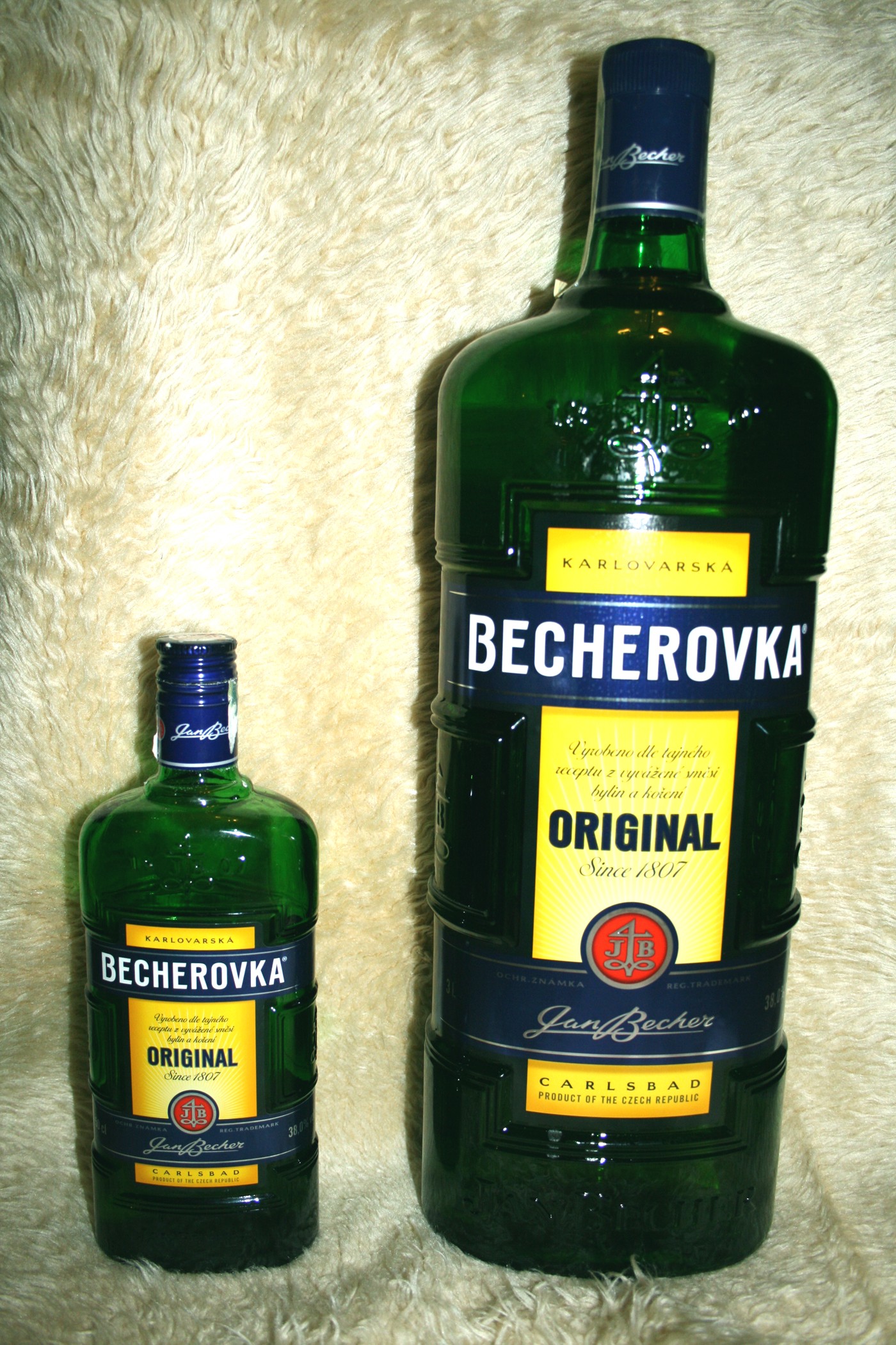 Two green Becherovka Original bottles with the front labels clearly visible.