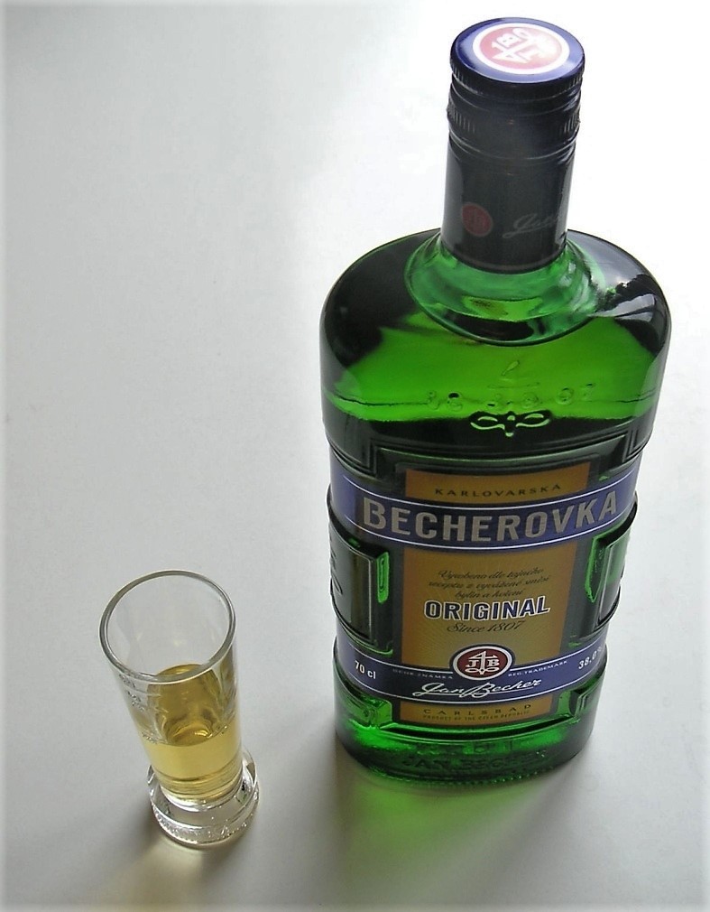 Single classic green Becherovka bottle photographed front-on.