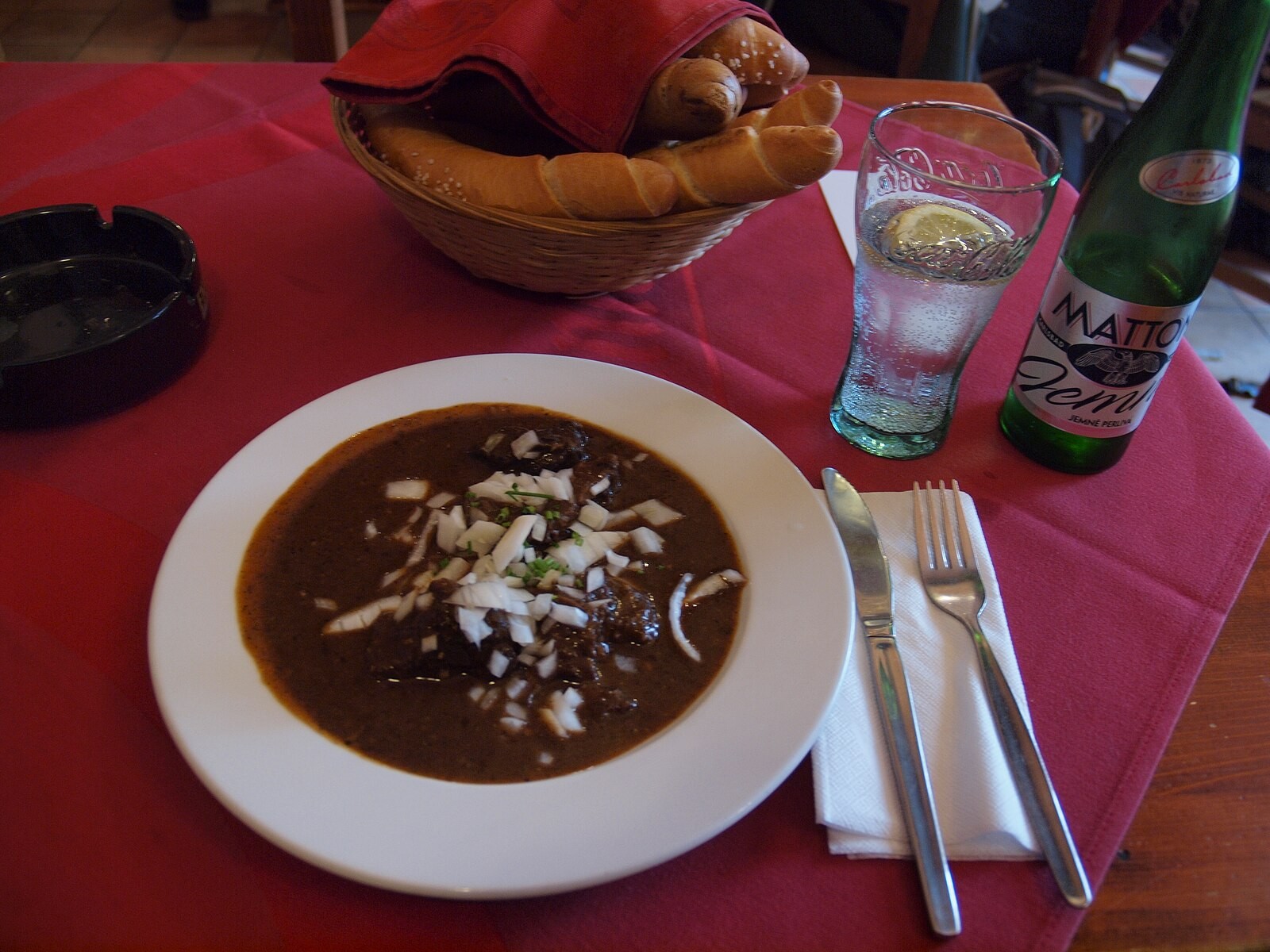 A serving of goulash photographed in Prague, visibly presented as a thick plated/stew-style dish.