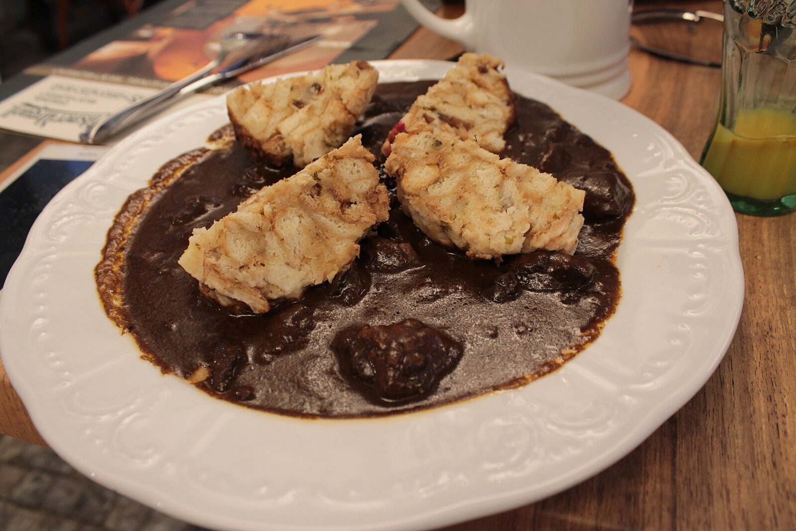 Plate of thick goulash served in Prague/Czech restaurant style.