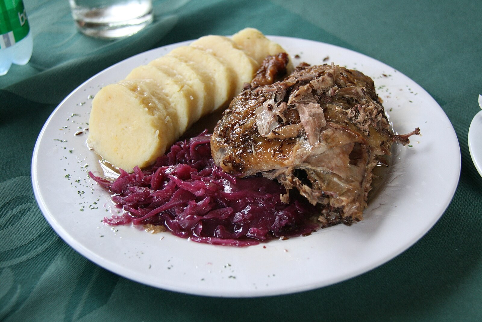 Czech roast duck served with dumplings and red cabbage.