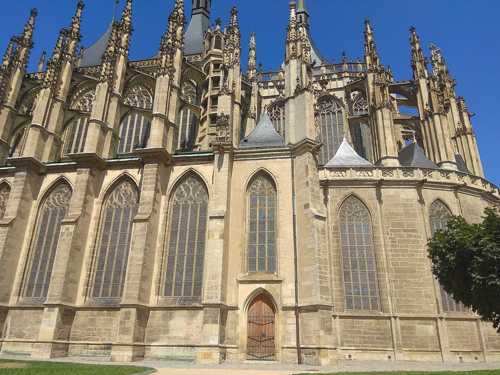 Exterior of St Barbara’s Church in Kutná Hora with Gothic buttresses and spires clearly visible.