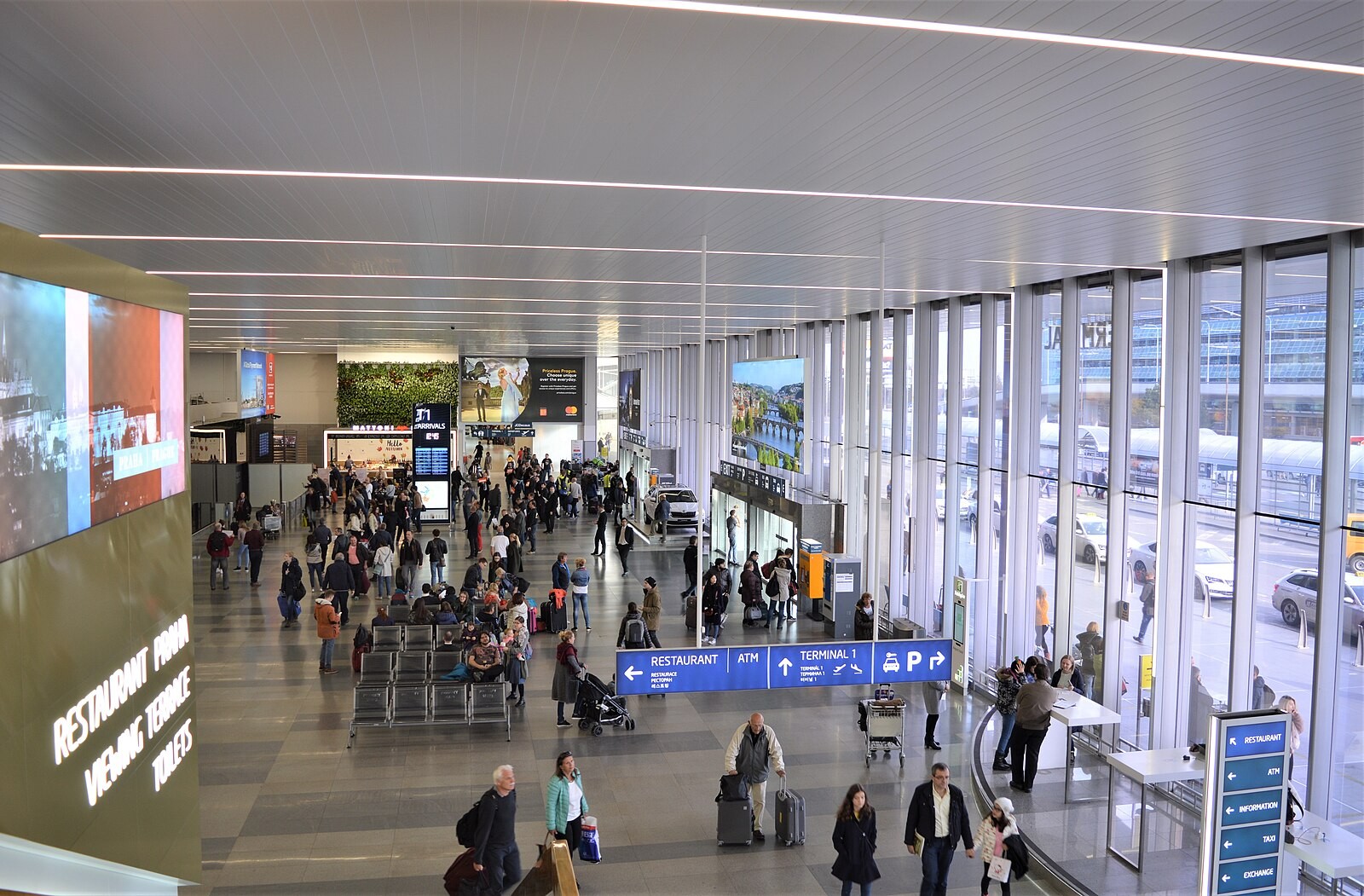 Interior of the Terminal 1 arrivals hall at Prague Airport.