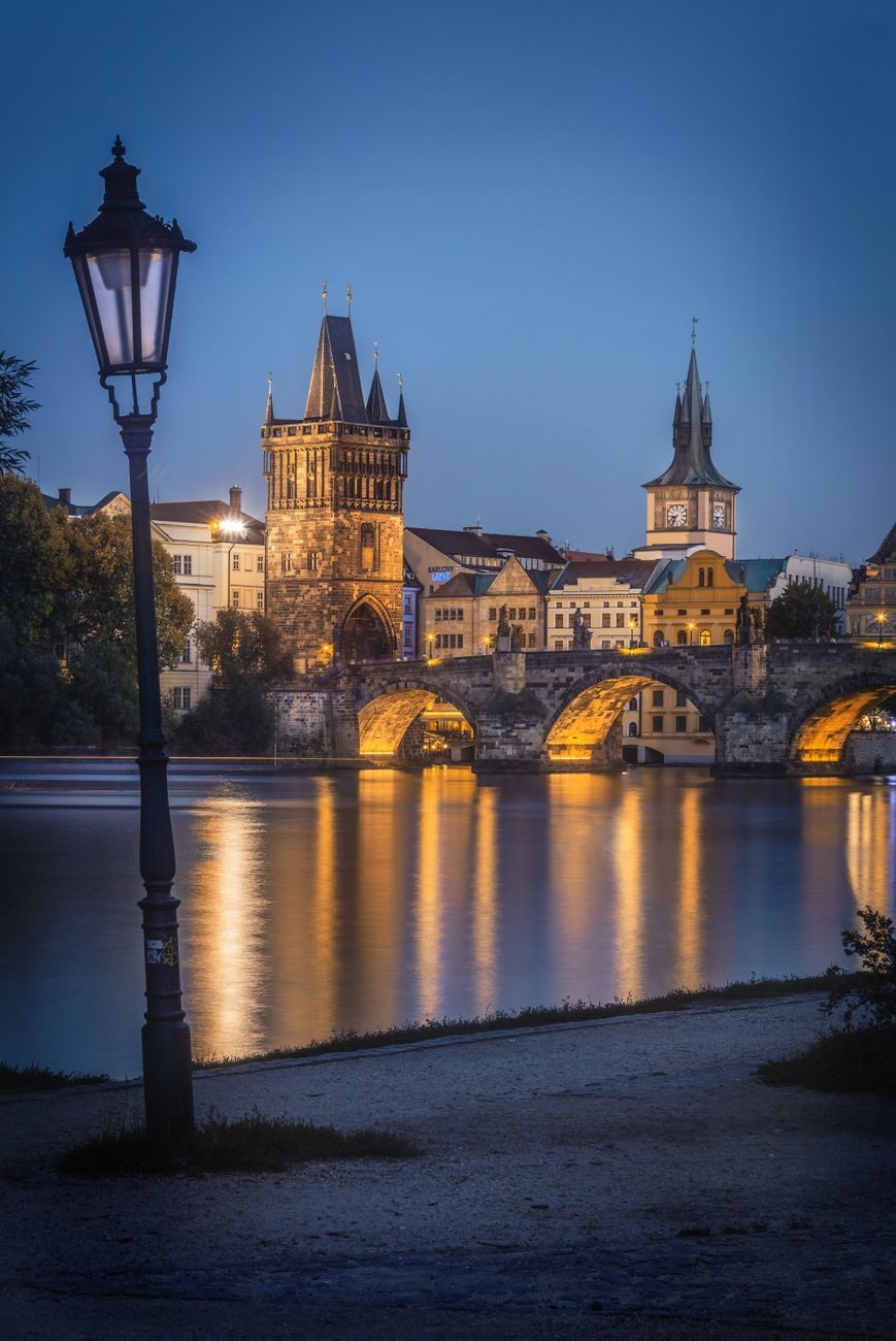Old Town Bridge Tower illuminated at night.