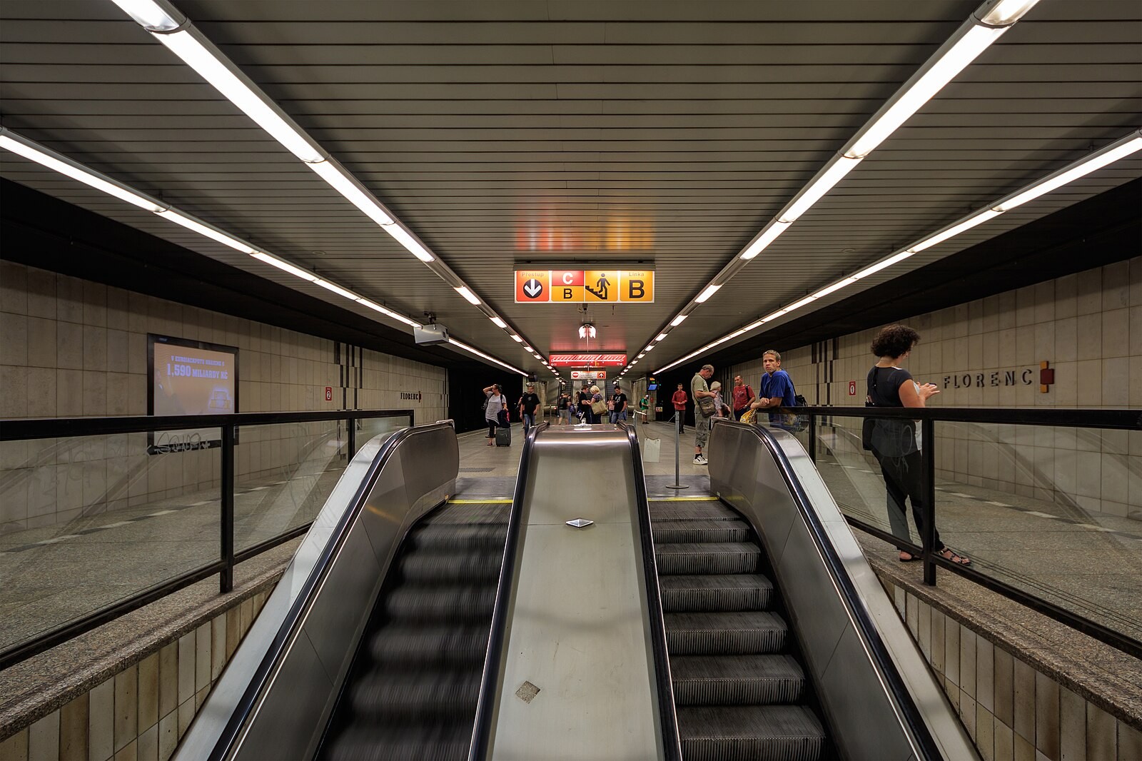 Florenc Line C metro station with escalators/platform circulation and Prague metro signage.