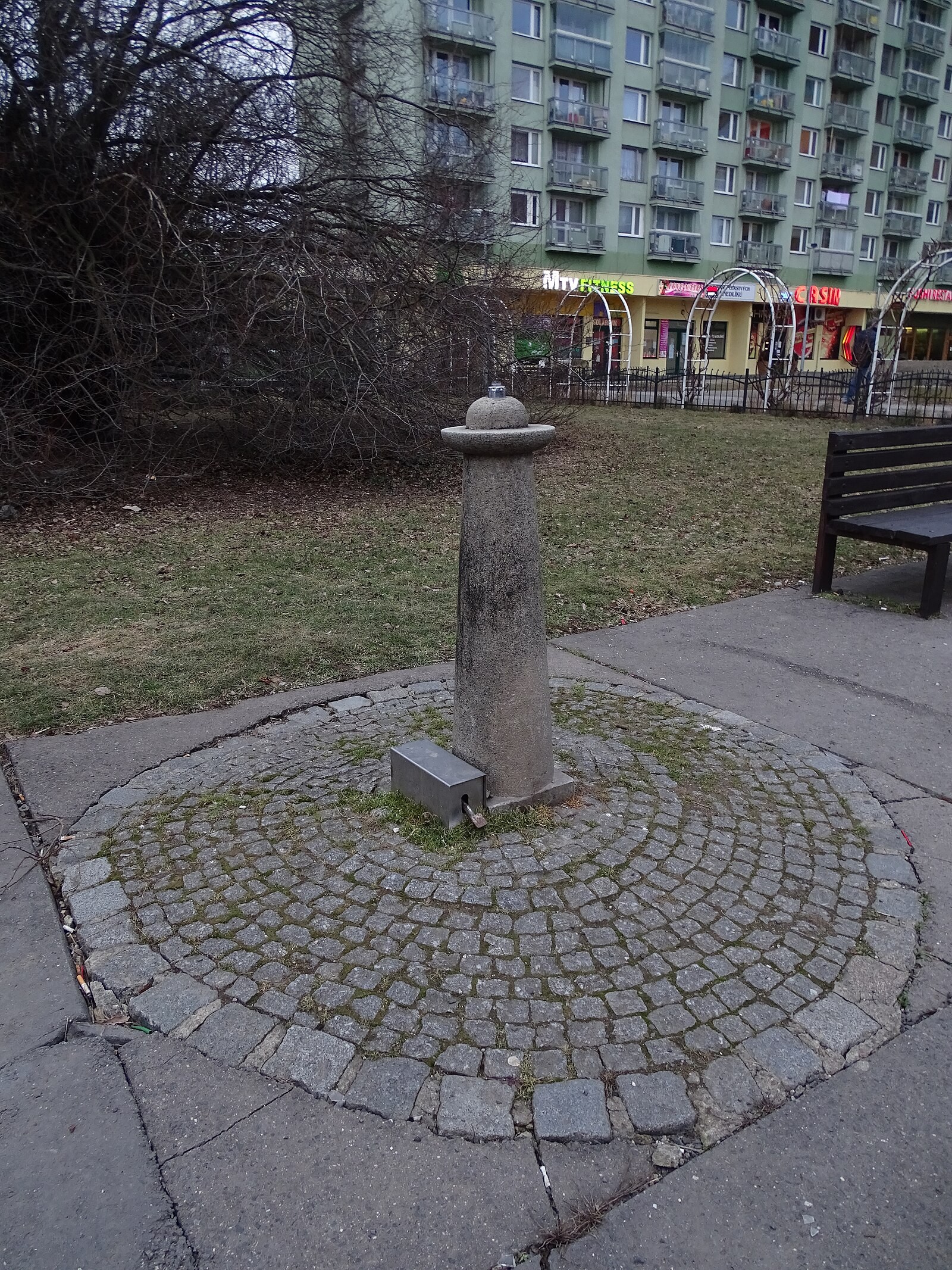 A public drinking-water fountain in a Prague park.