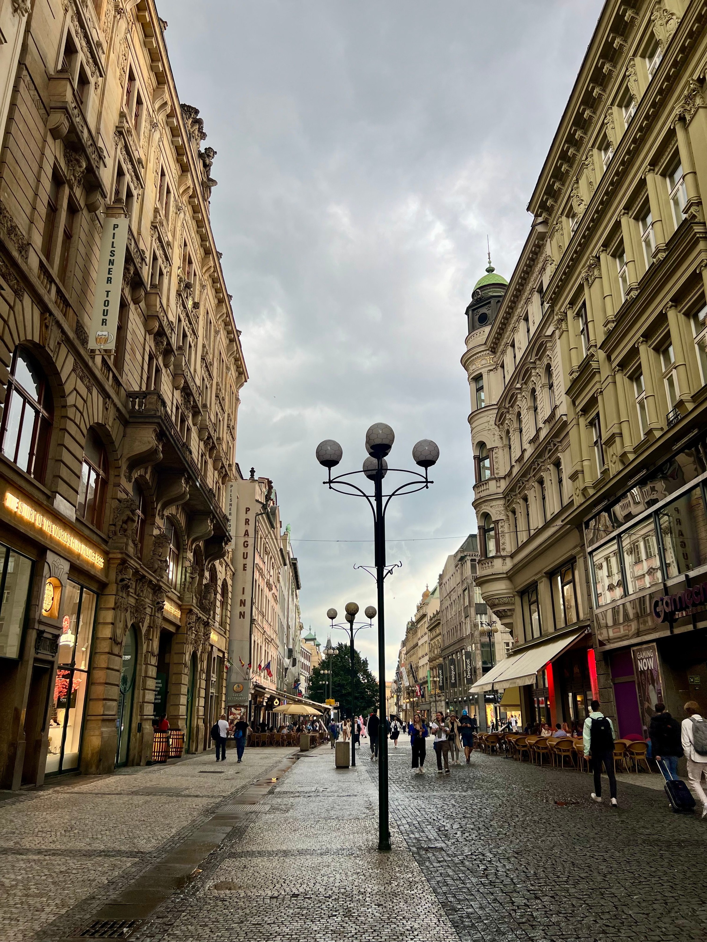 Old Town Prague street with the uneven cobblestone walking surface clearly visible.