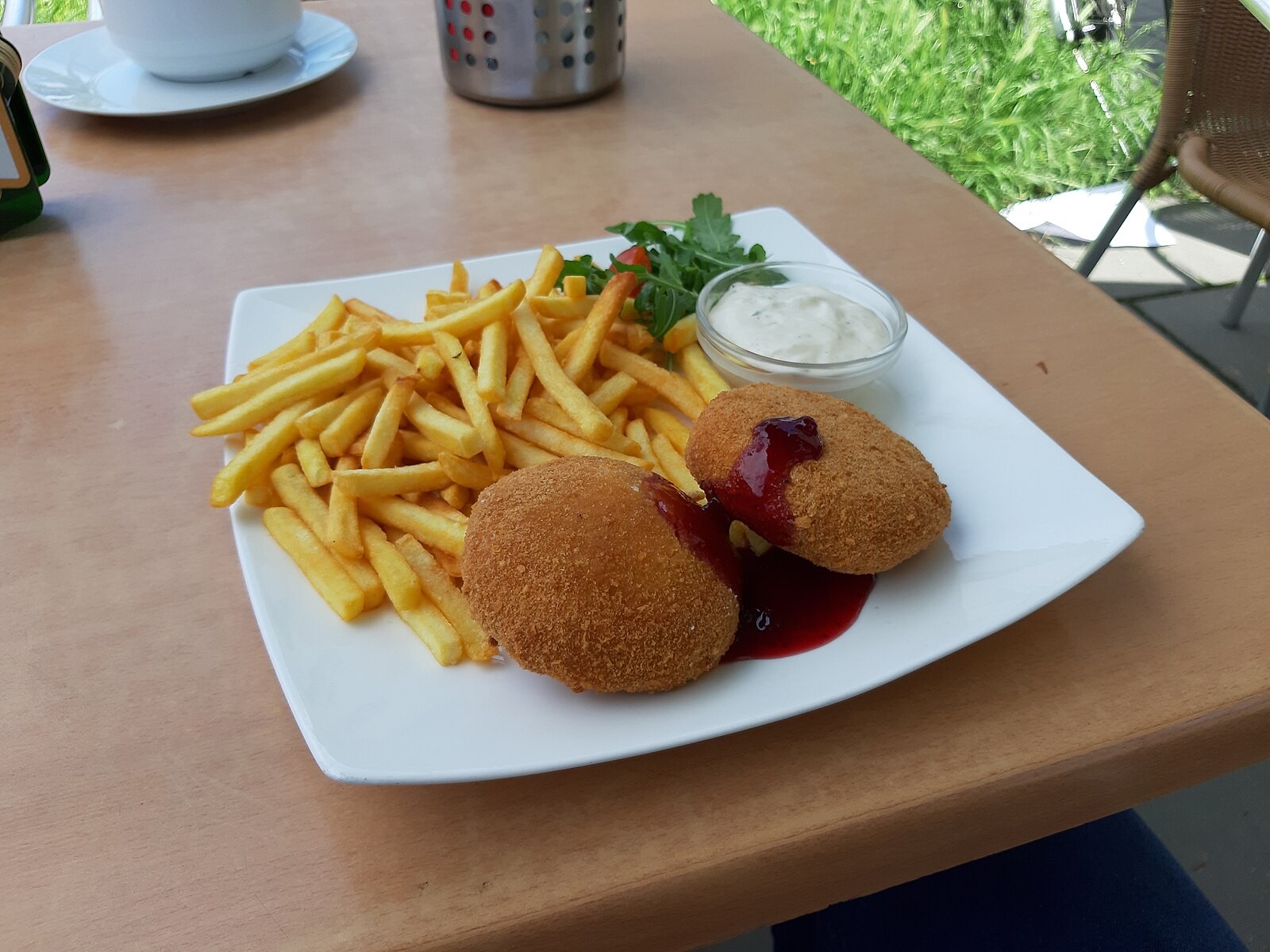 Breaded fried cheese served with fries and tartar-style sauce.