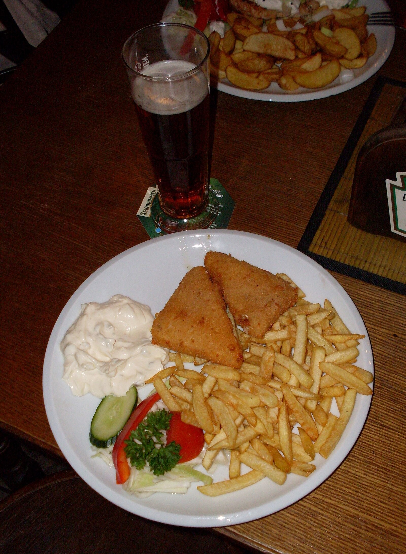 Fried cheese served with fries and beer, a common pub/restaurant combination.