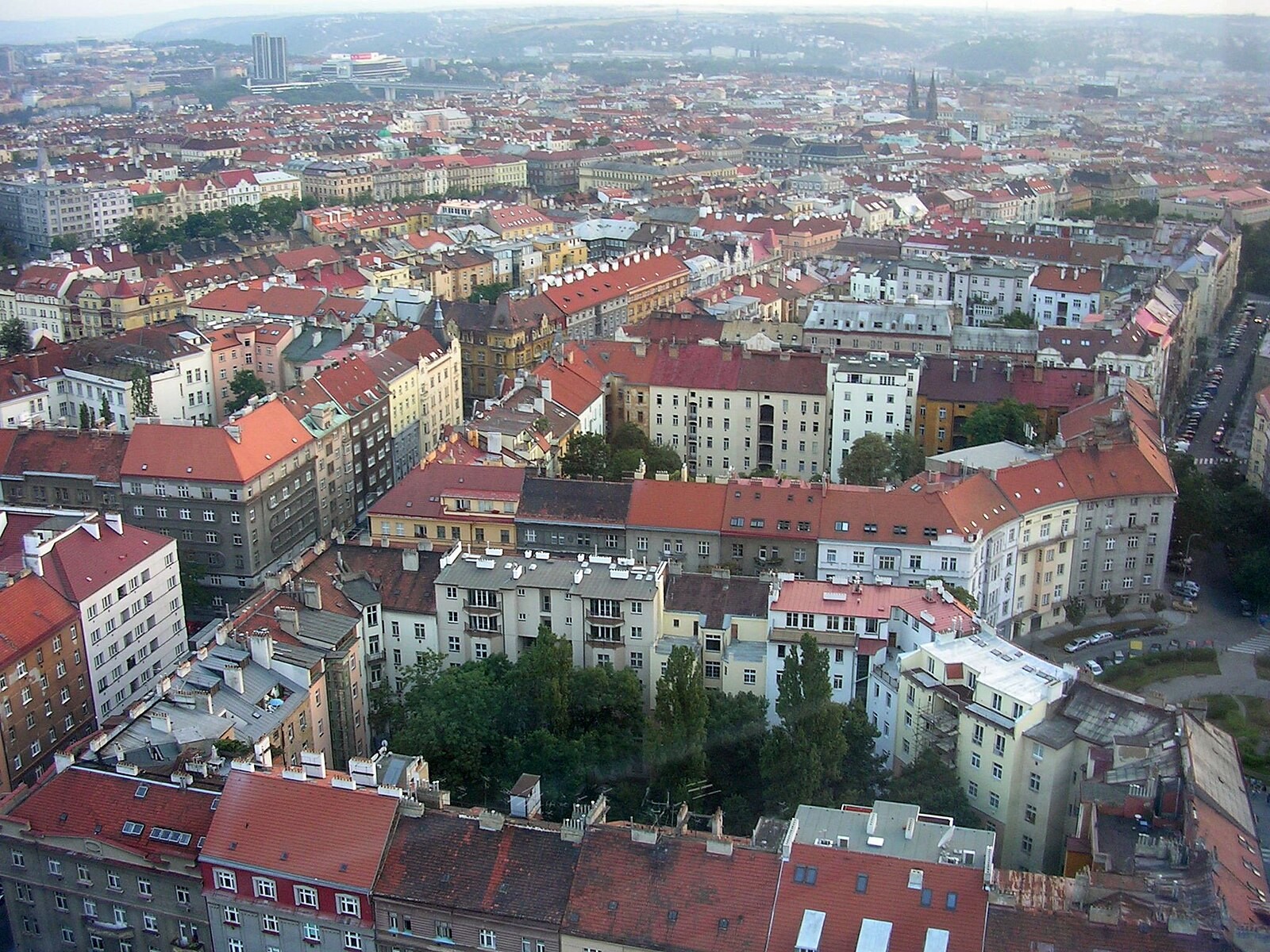 Dense residential roofscape of Vinohrady/Žižkov seen from the Žižkov Television Tower.