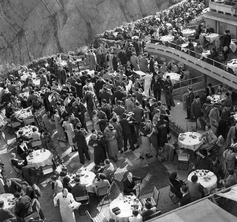 1937 archival view of the busy multi-level terraces with guests and tables.