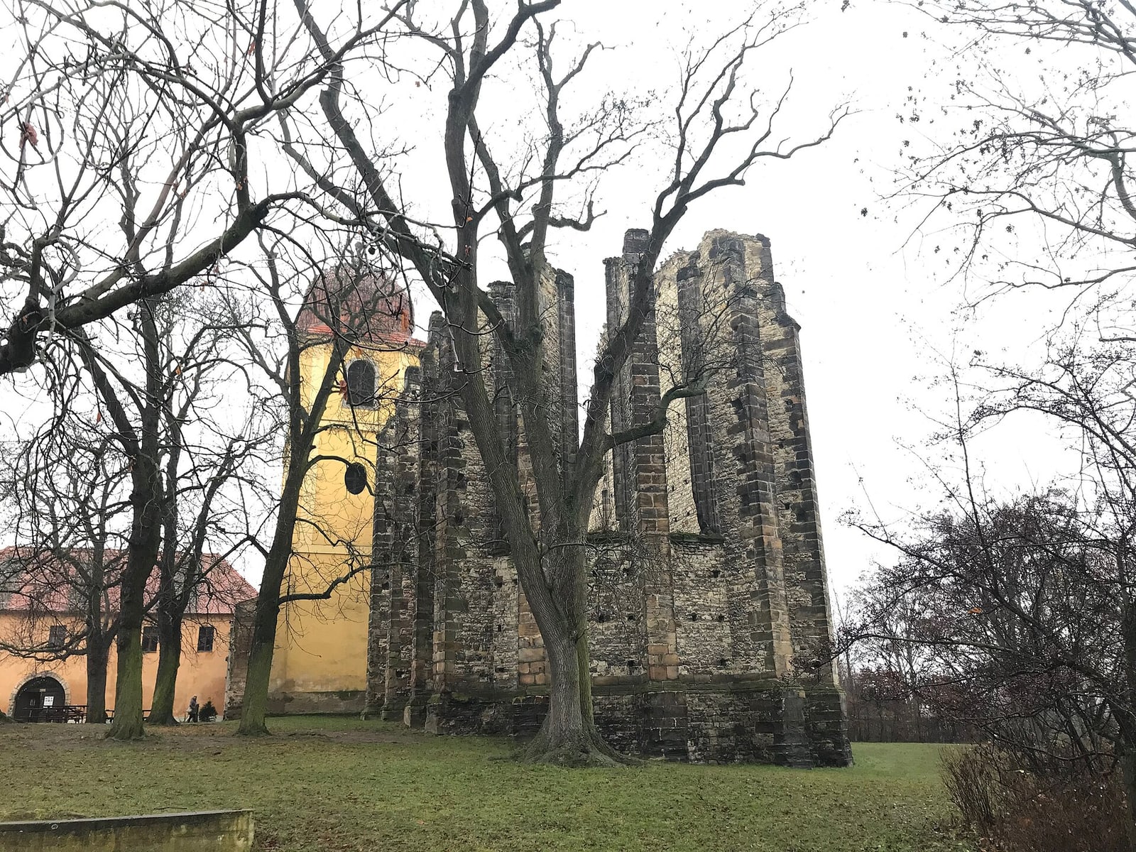 Rear exterior view showing unfinished buttresses/walls.