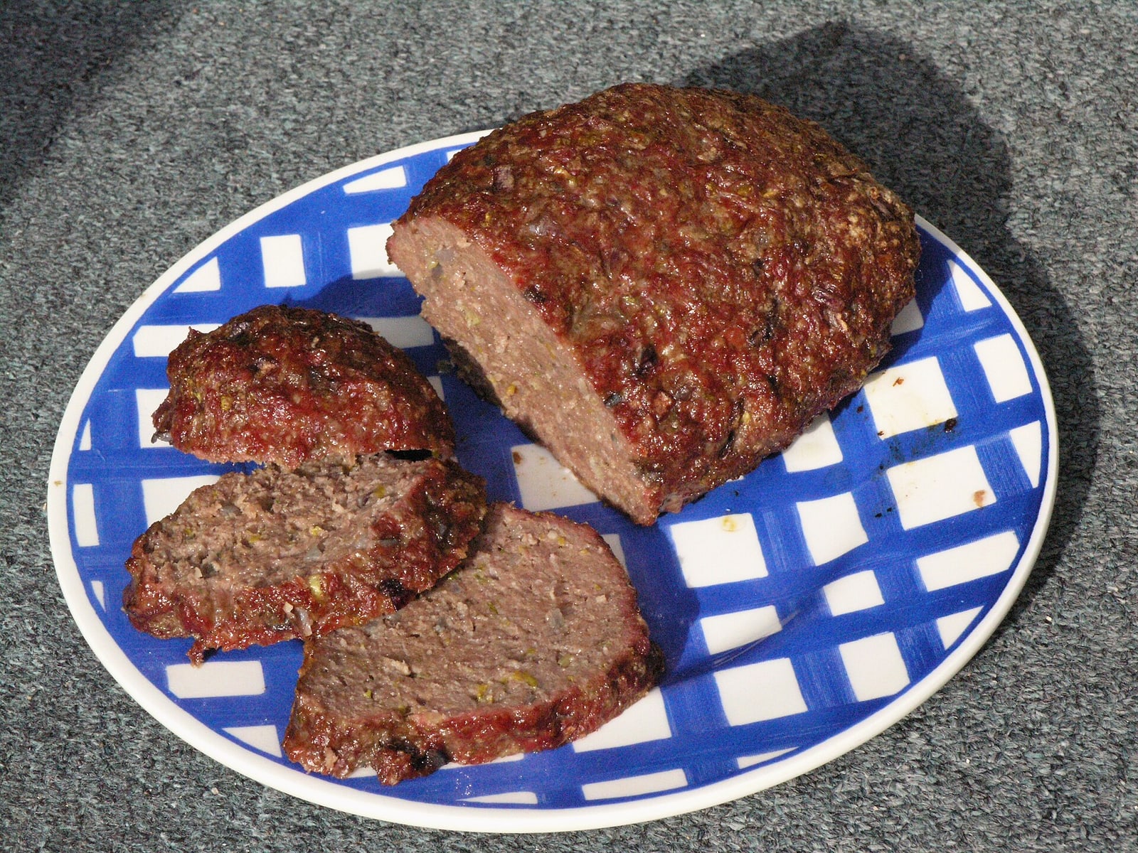 Sliced Czech sekaná (meatloaf), clearly showing the cooked interior.