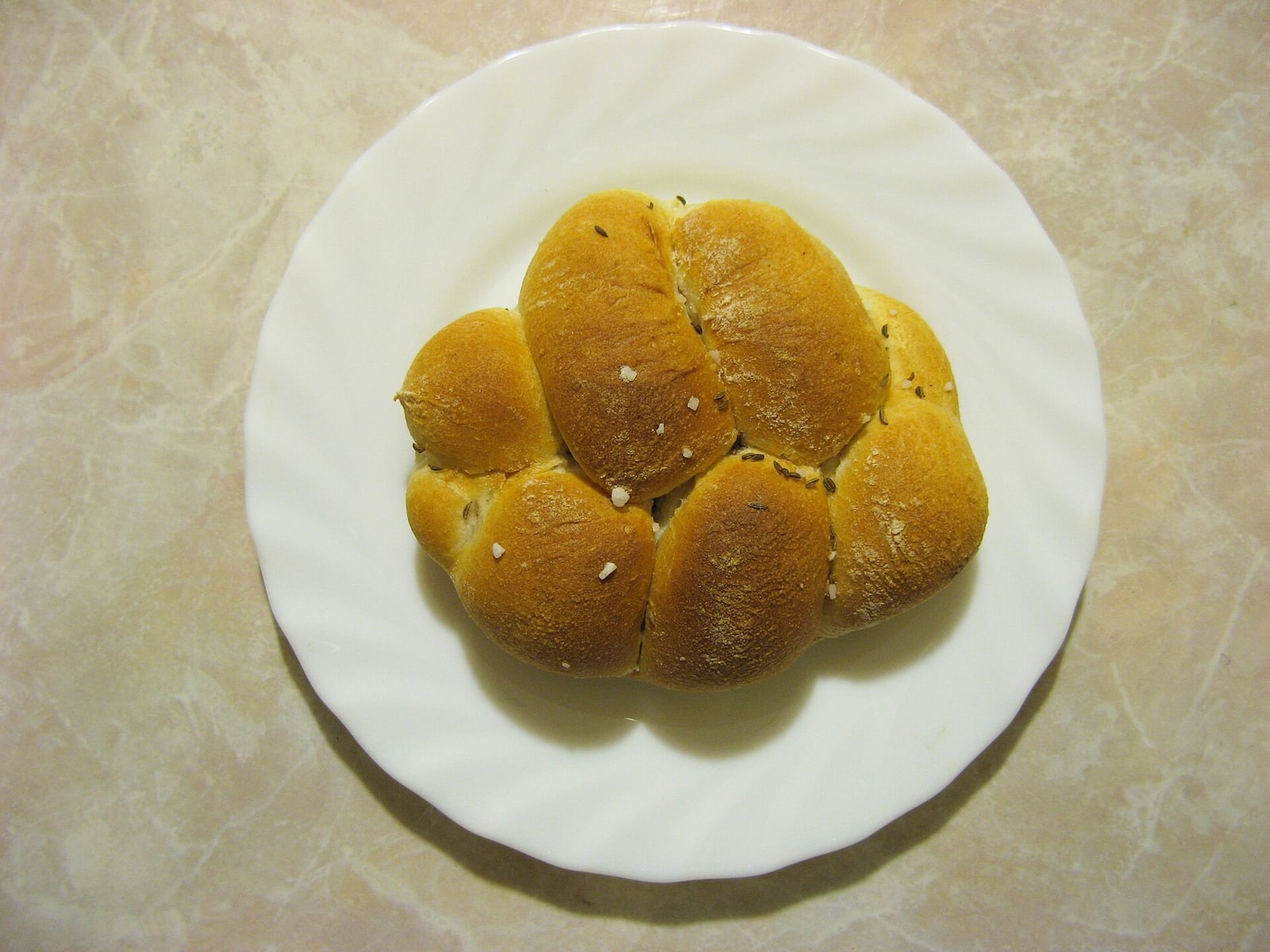 Classic Czech houska bread roll, the bread component of sekaná v housce.