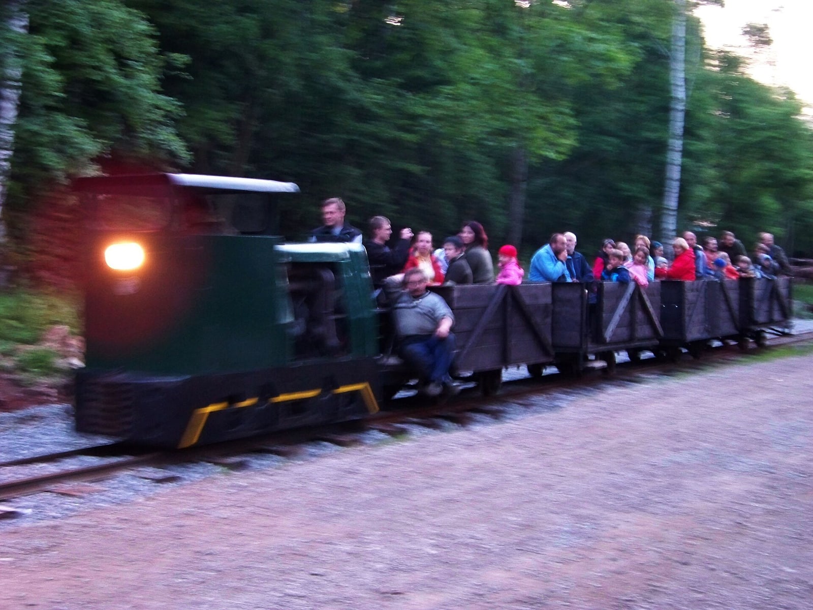 Narrow-gauge train carrying visitors through the Solvay Quarries site.