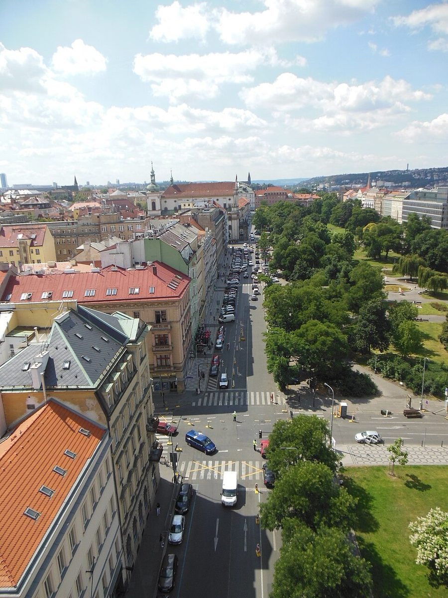Elevated portrait view along the long green axis of Charles Square and adjacent streets.