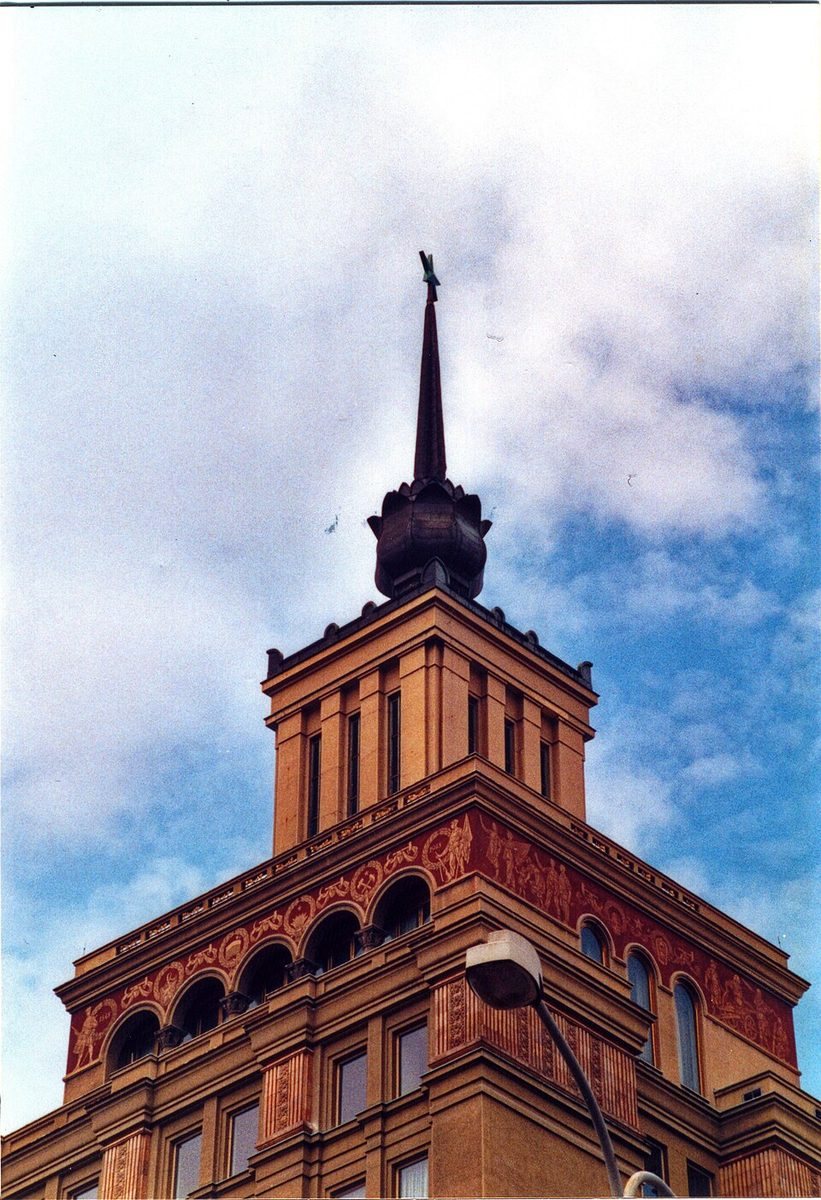 Close dramatic portrait of the upper Socialist Realist tower and spire.