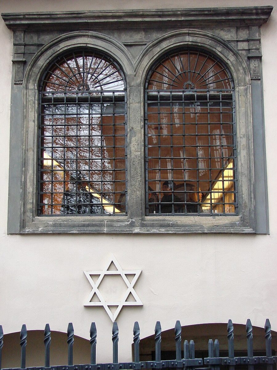 Exterior wall/window with Star of David and synagogue architectural cues.