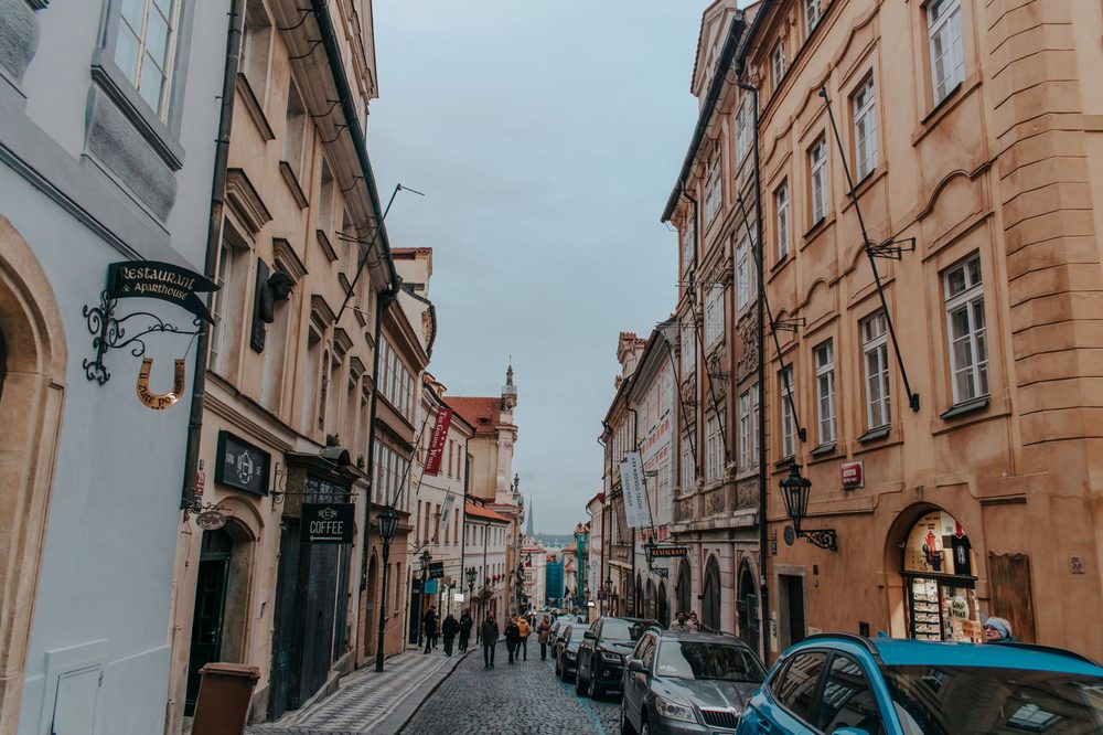Approved Prague neighbourhood scene used as generic redevelopment context; exact Karlín block is not asserted visually.