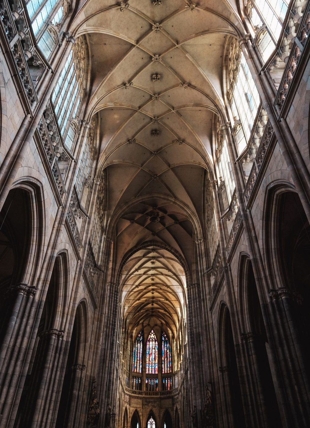 Vertical nave view visibly shows repeated pointed arches, tall clustered supports and ribbed vaulting.