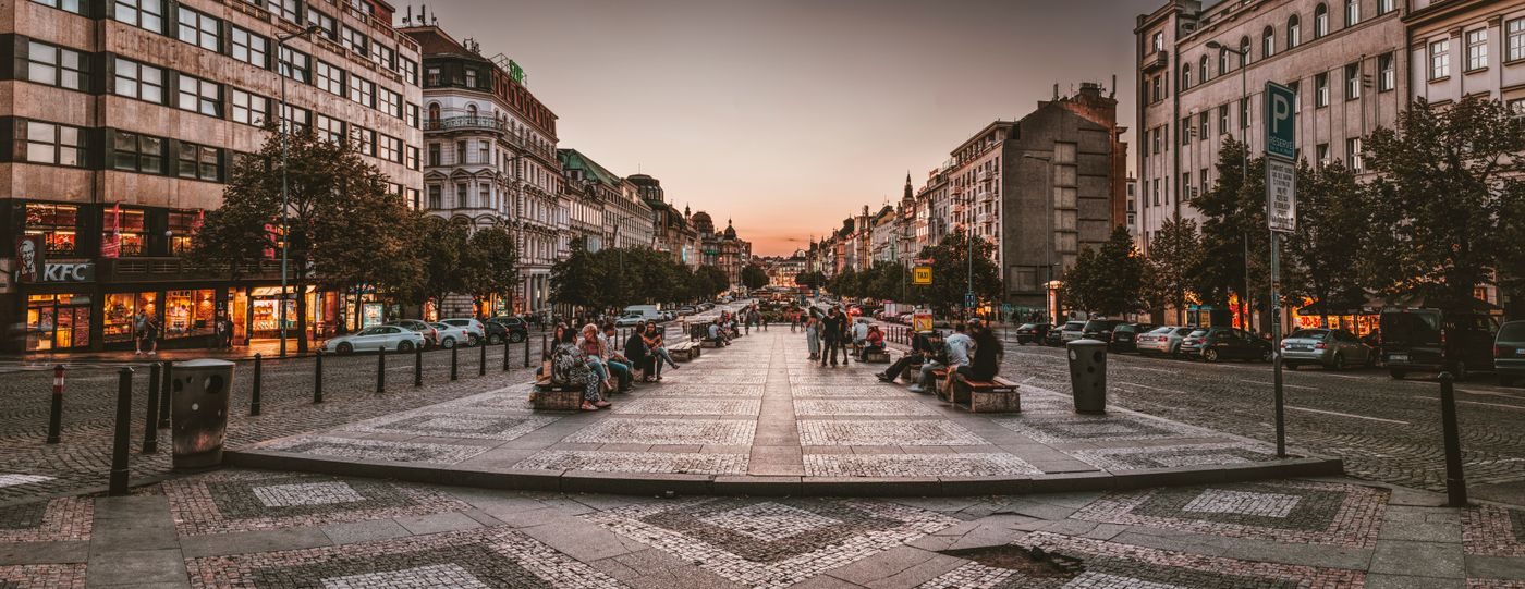 Current Prague/Wenceslas street scene visibly includes street lights and public seating.