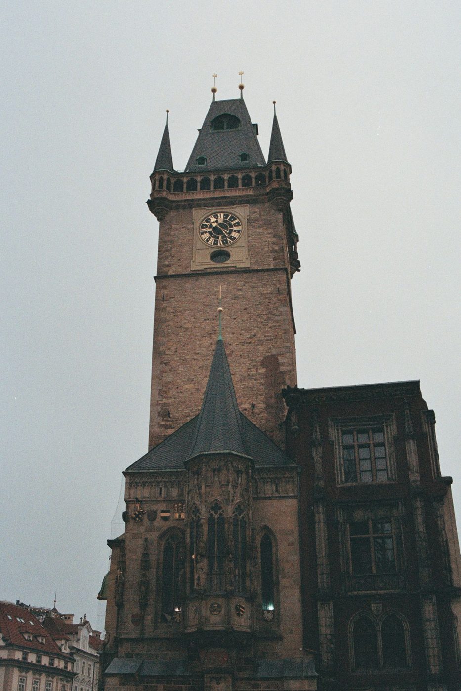 Exact Old Town Hall tower/clock façade is visibly shown in a vertical composition.