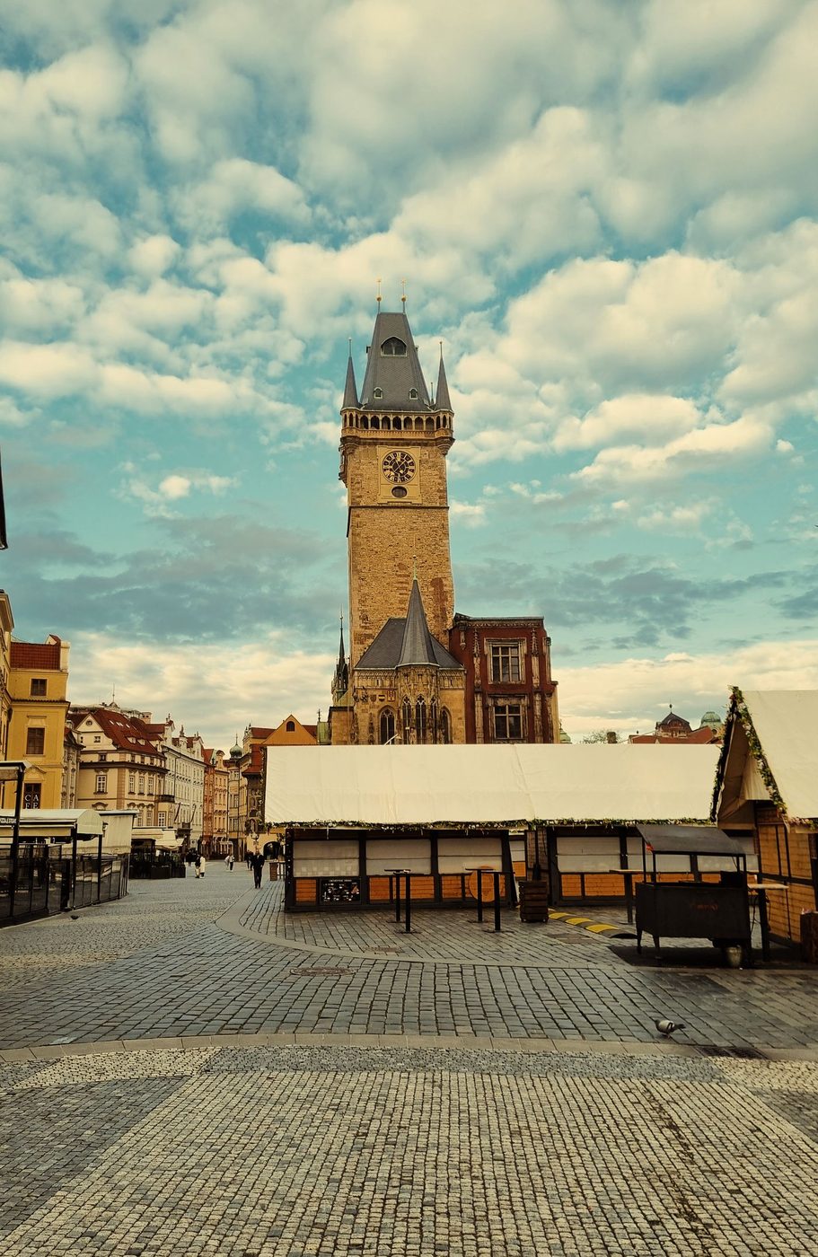 Exact Old Town Hall Tower is visibly identifiable against the Prague sky.