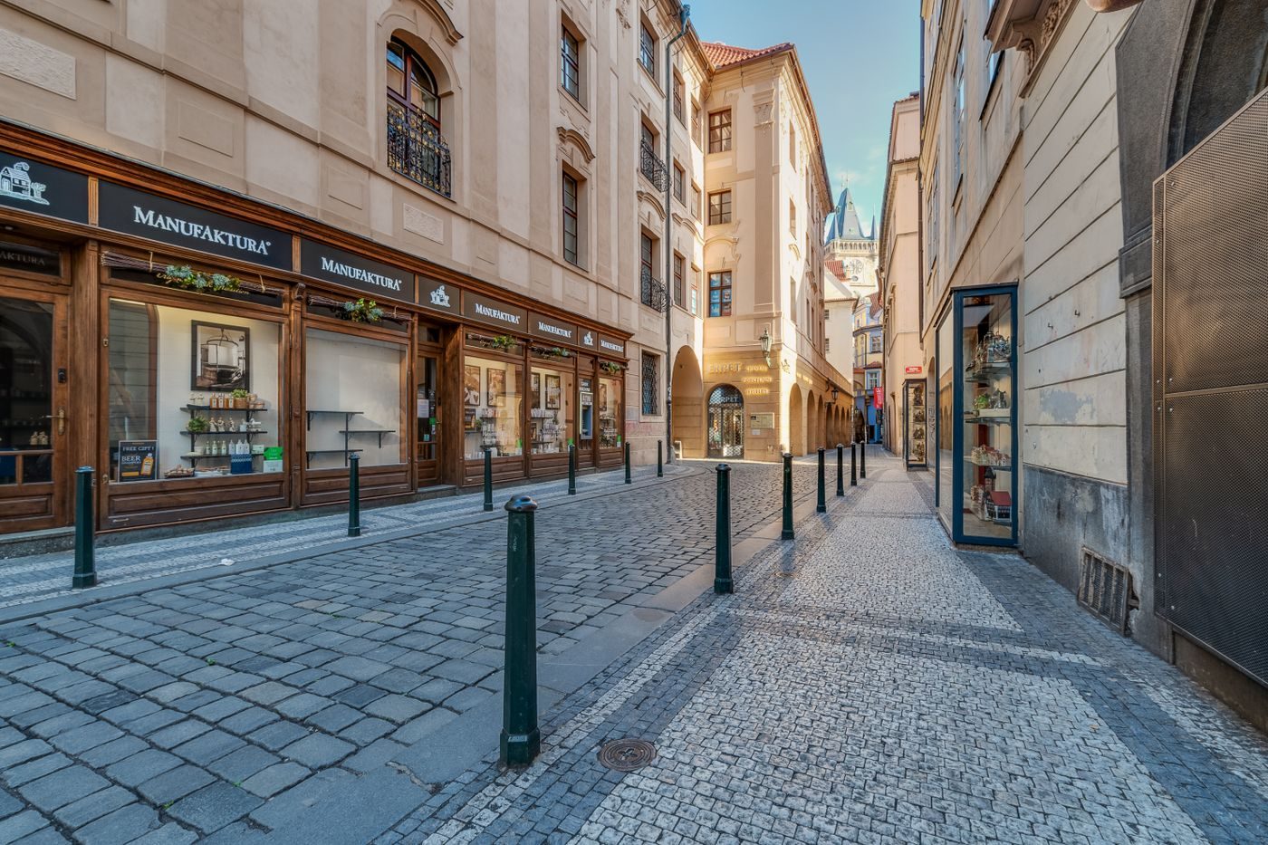 Old Prague cobbled pedestrian surface is visibly present.