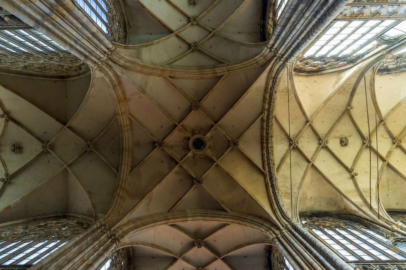 Upward view isolates the cathedral’s rib-vault ceiling geometry.