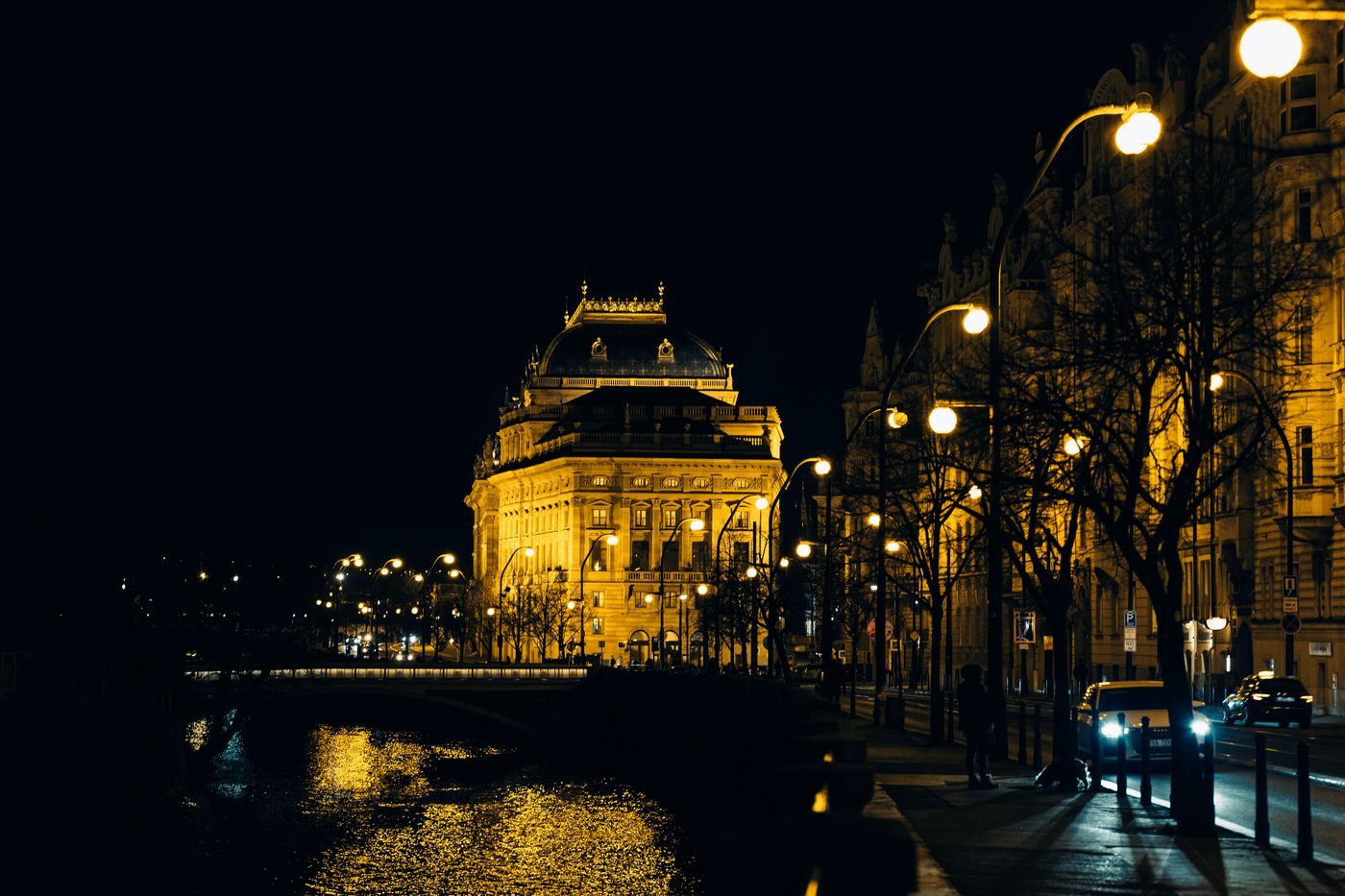 Historic National Theatre is visibly illuminated by the Vltava.