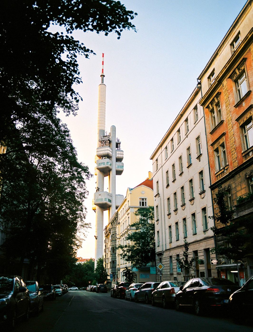 Pexels explicitly identifies Žižkov Television Tower from a Prague street, giving a strong district cue.