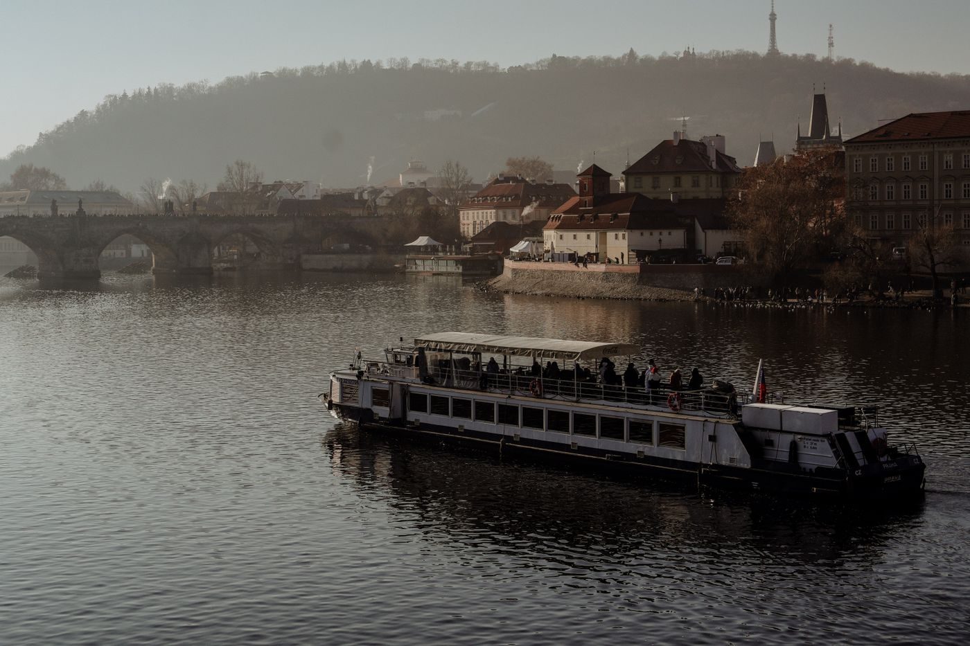 Prague Vltava/Old Town river context is visibly established.