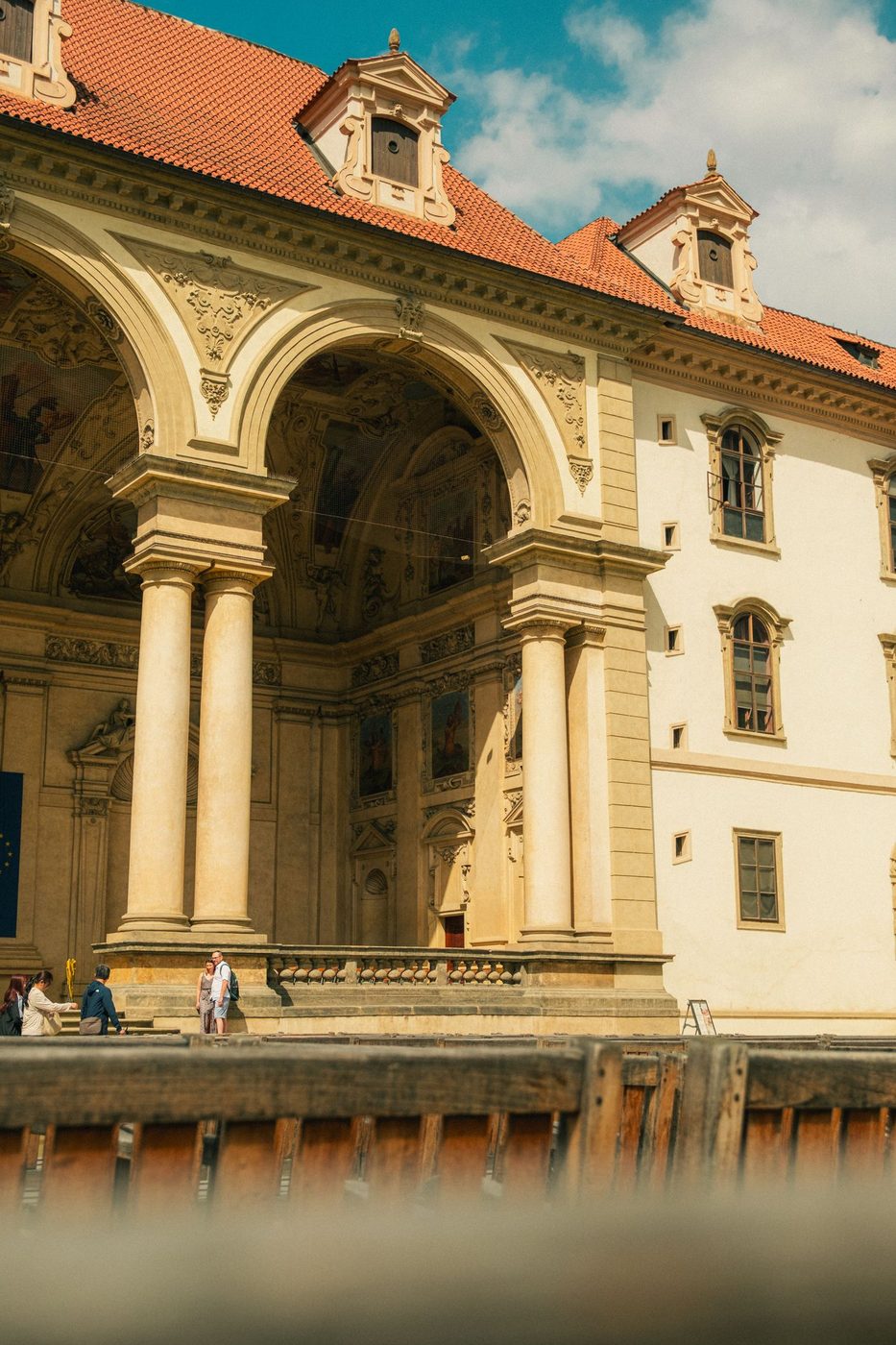 Exact Wallenstein Garden frame visibly includes historic palace architecture, columns and formal greenery.