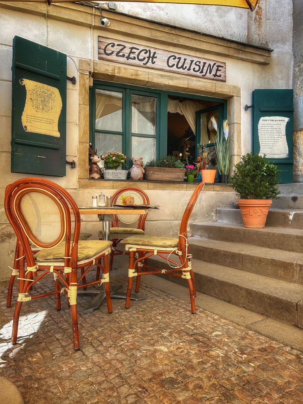 A Czech street café in Prague is visibly shown.